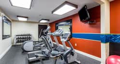 Fitness Center with Cycle Machine, Treadmill, Cross-Trainer and Wall Mounted HDTV