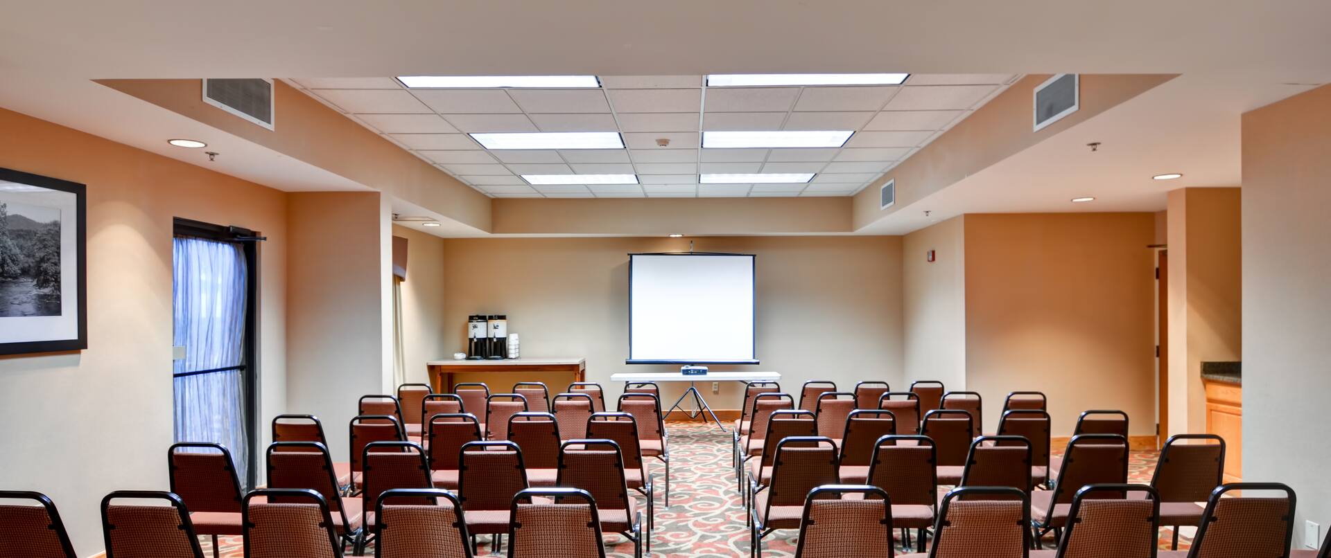 Meeting Room Conference Setup with Projector Screen