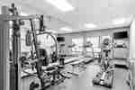 fitness room with machines and equipment