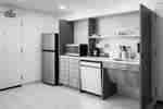 Guest Room Accessible Kitchen with Dinnerware, Amenities, and Appliances