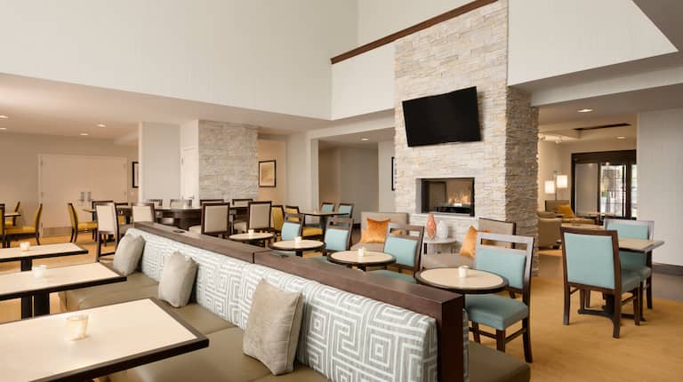 Spacious Lobby with Comfortable Seating and Tables with Chairs