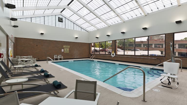 an indoor pool and lounge seating