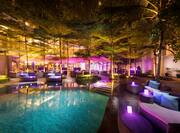 Lounge Poolside Area at Night with Purple Lighting
