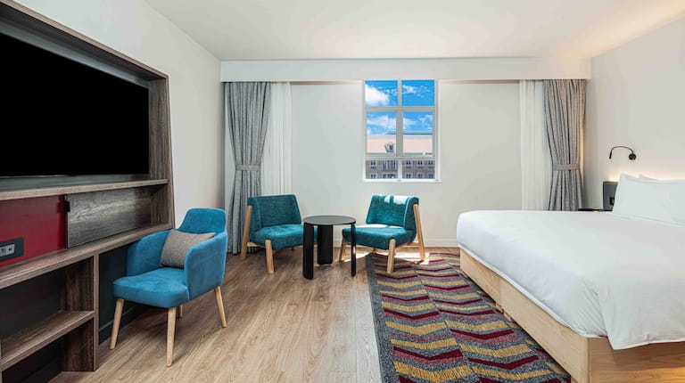 King Bedroom with Table, Chairs, and TV