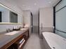 Bathroom with two sinks and tub