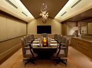 Meeting Room with Large Conference Table, Executive Chairs, and Domed Ceiling