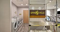 Spin2Cycle Towel Rack Laundry Room with Coin-Operated Washing Machines