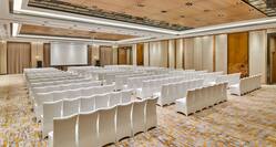 Meeting space with white chairs and projector