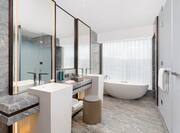 Bathroom with tub and shower room