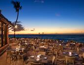 Outdoor Oceanside Restaurant Dining Area at Sunset