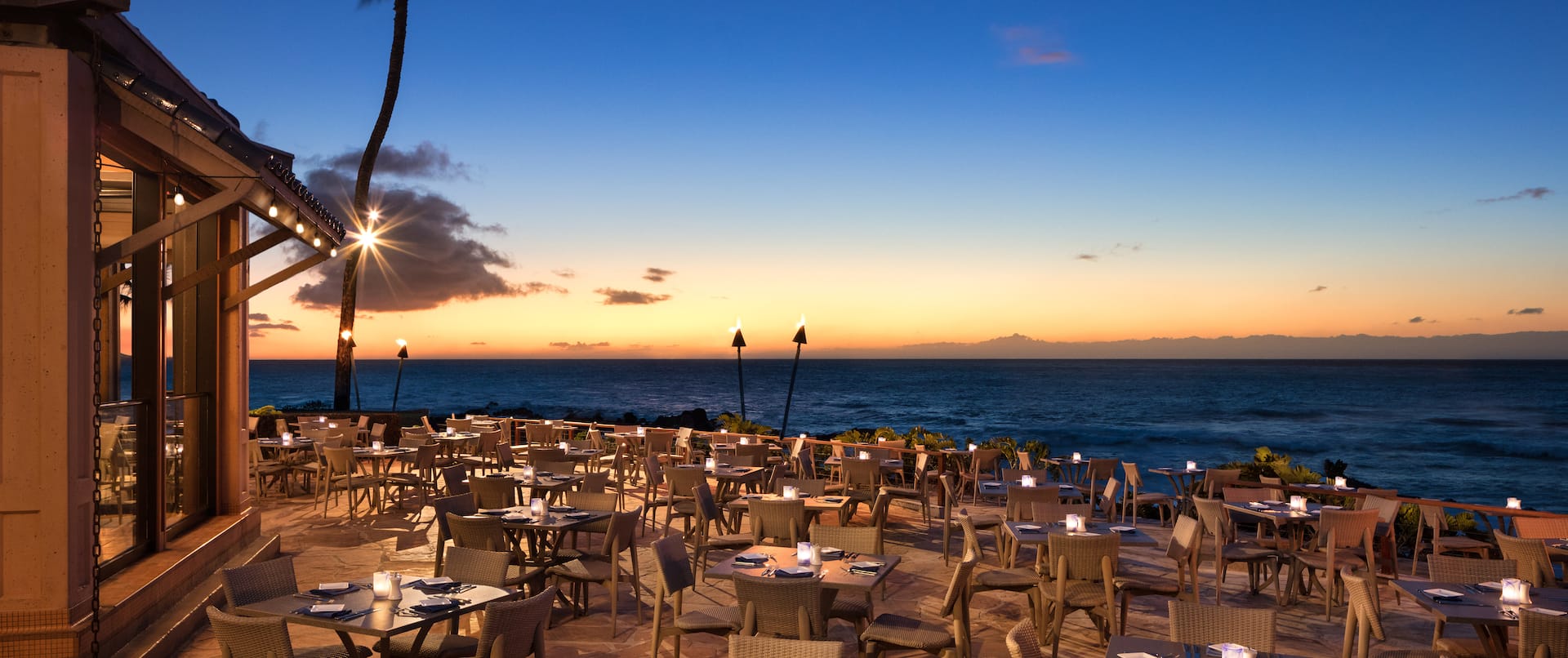 Outdoor Oceanside Restaurant Dining Area at Sunset