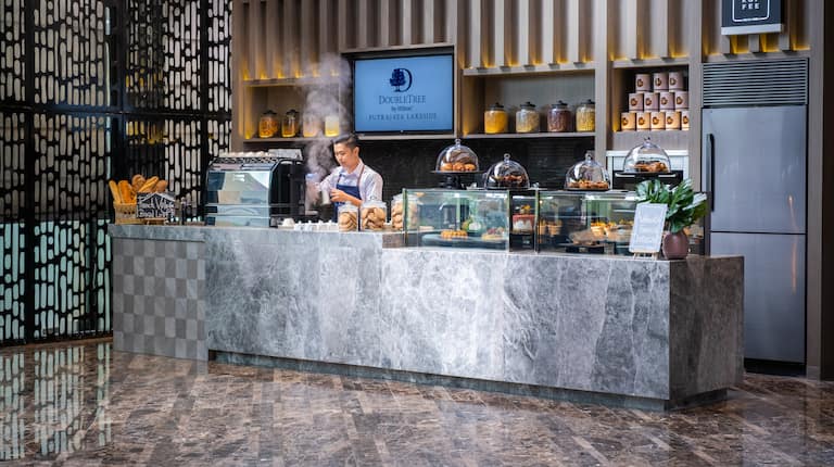 The Koffee shop counter with barista