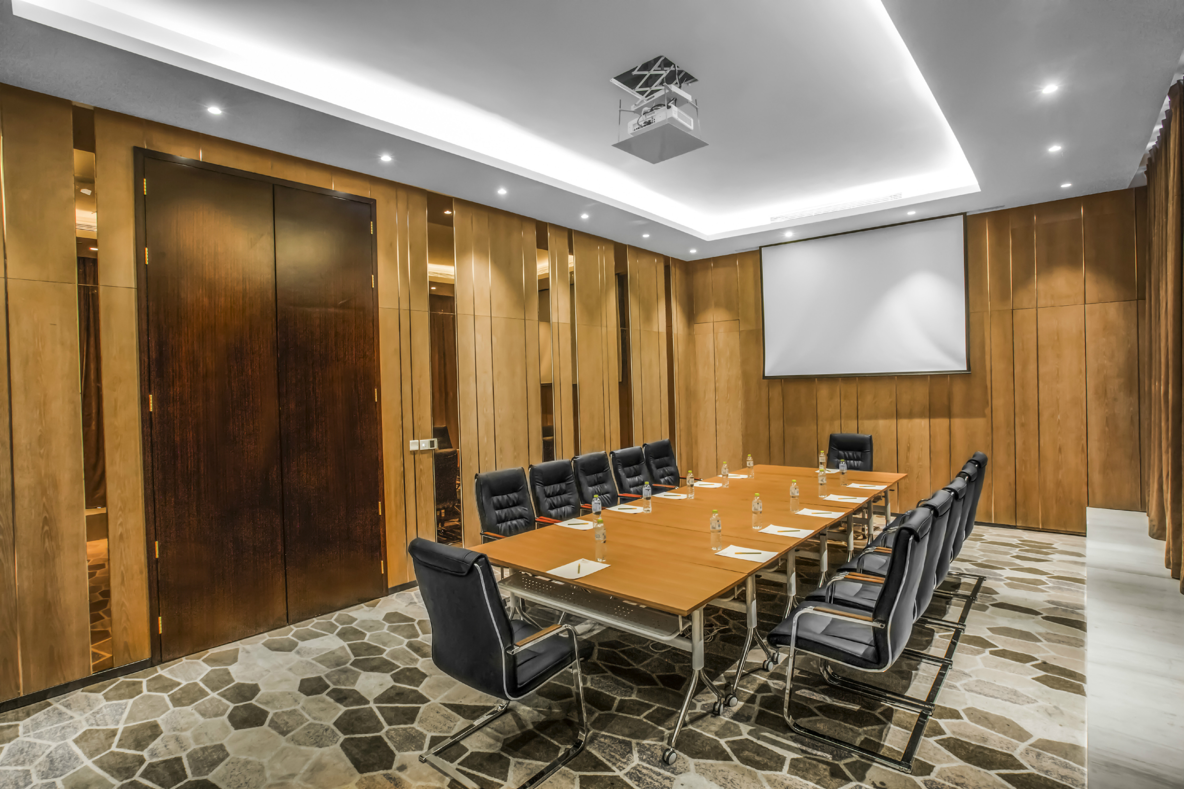 Boardroom with Conference Table and Projector Screen