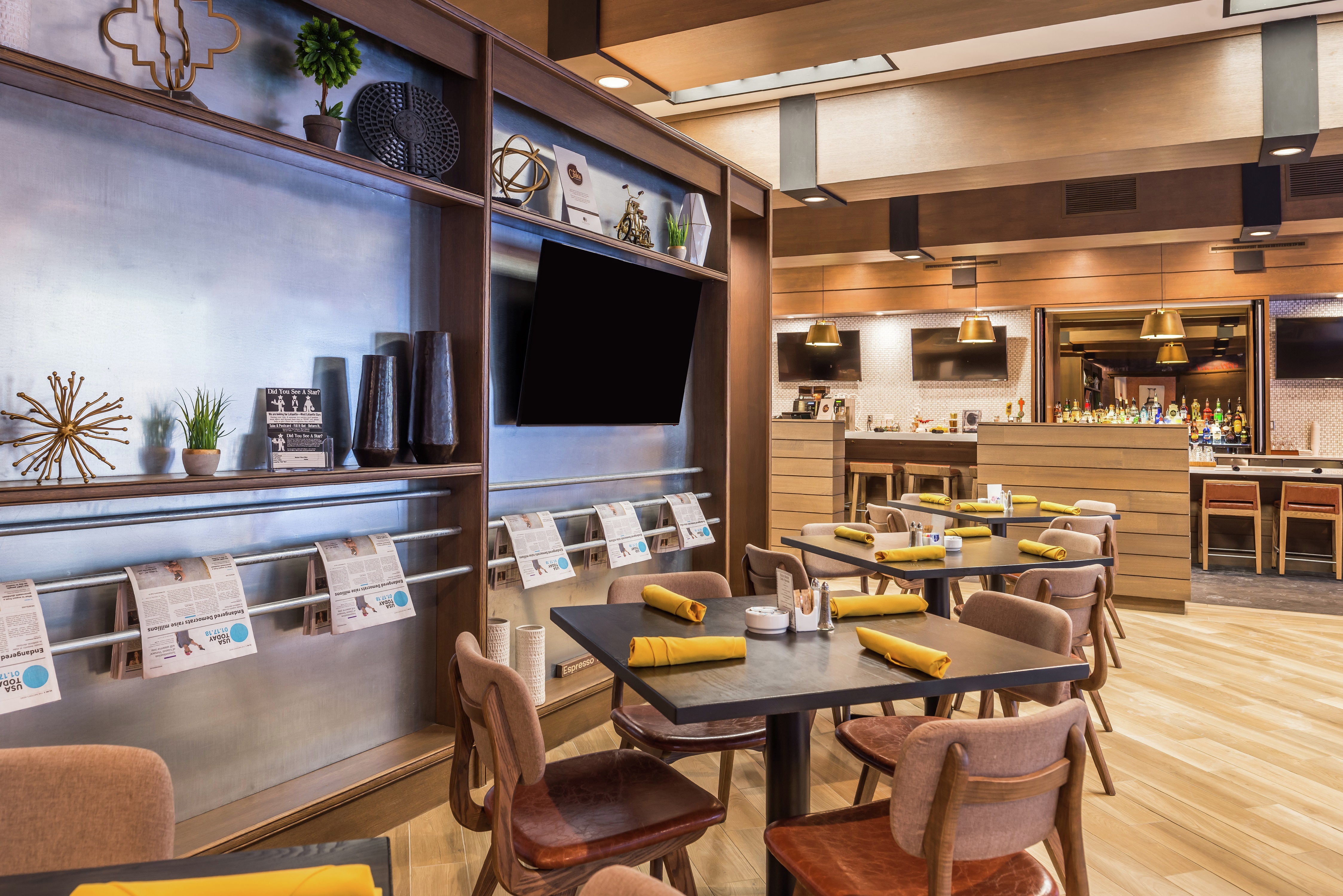 Televisions, Bar, Dining Tables, and Chairs in Made Market Restaurant