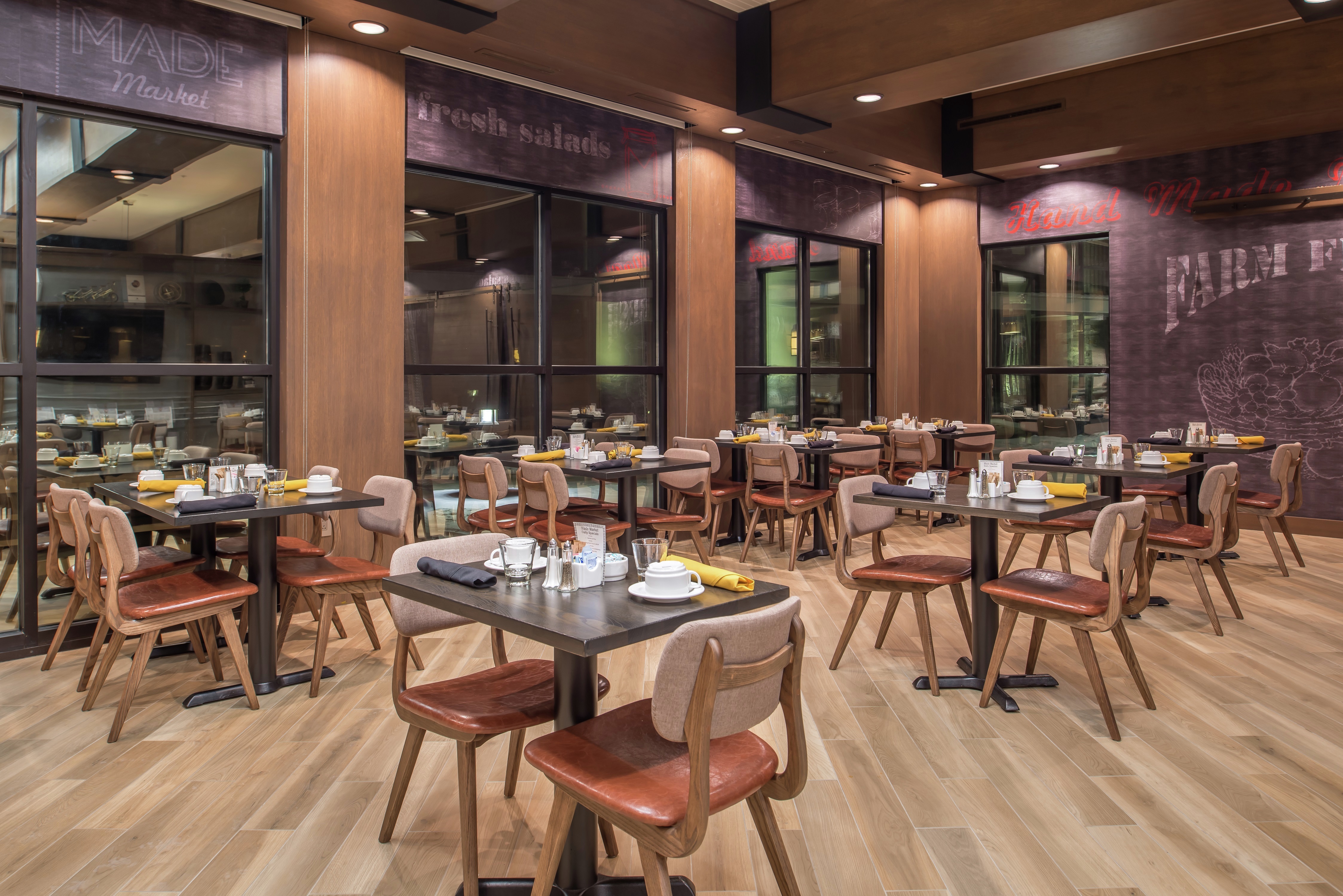 Dining Tables and Chairs in Made Market Restaurant With Large Windows