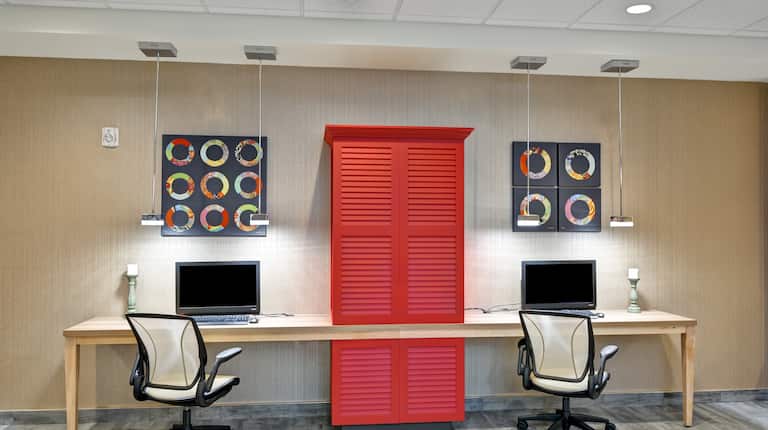Business Center with Two Desktop Computers, Two Office Chair and Red Cabinet