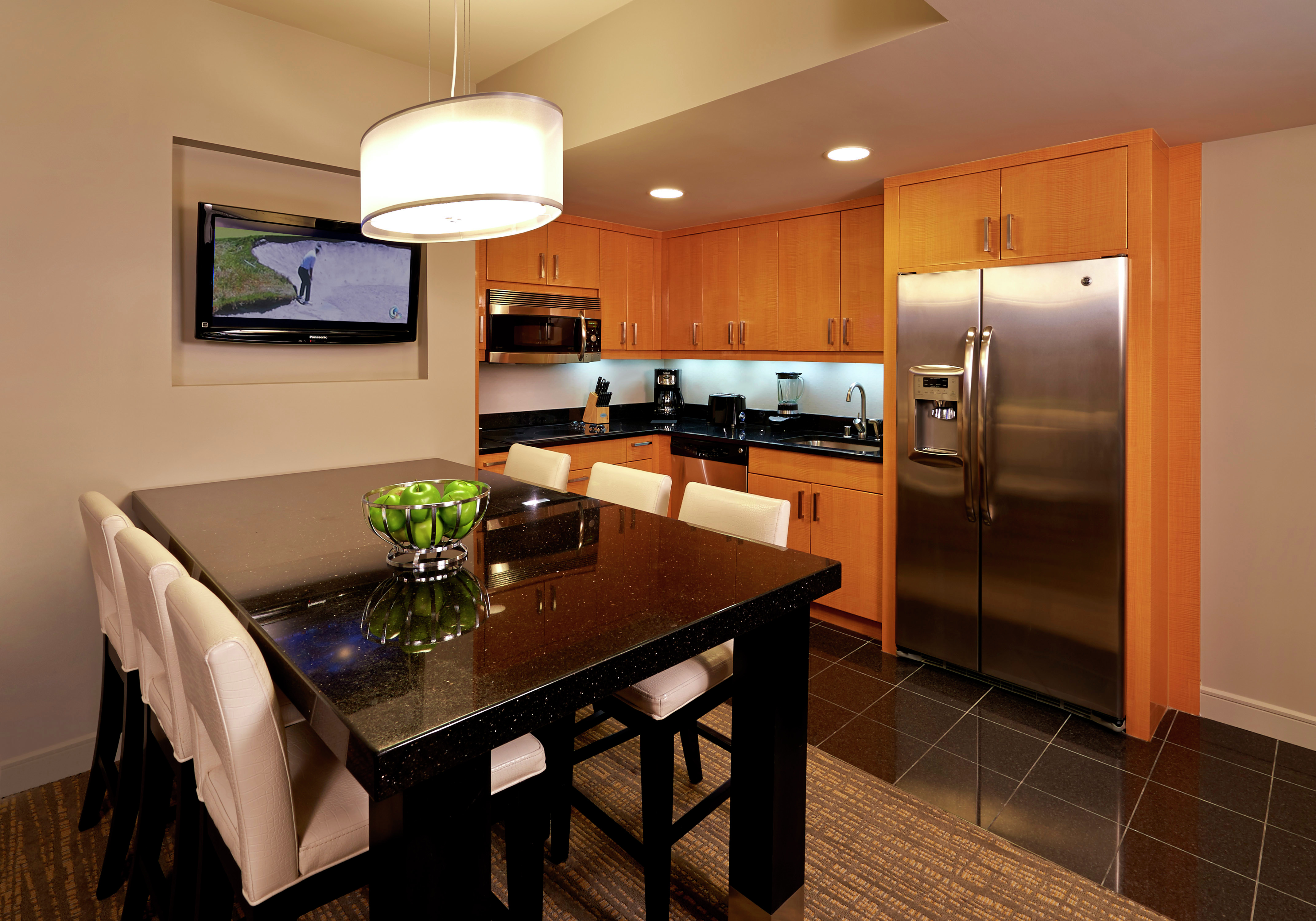 Suite Kitchen with Dining Table and TV
