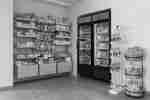 Snack shop in hotel lobby with drink in fridges and snacks on shelves