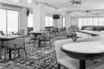 Dining Area in hotel lobby with table and chairs