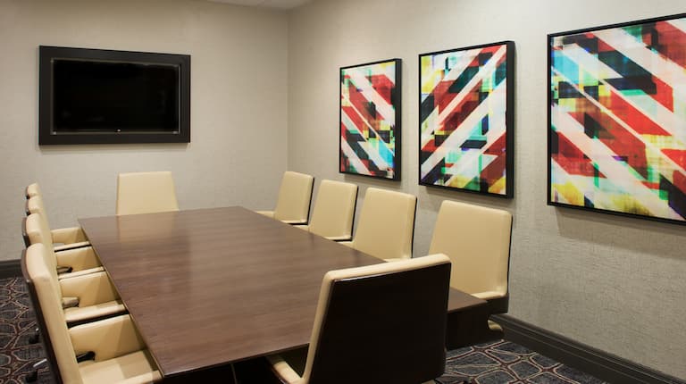 Meeting Room with Tables, Office Chairs and Wall Mounted HDTV