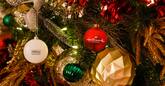 Christmas tree close up with Hallmark and Hilton branded ornaments