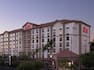 Evening View of a Hampton Inn and Suites Hotel Exterior