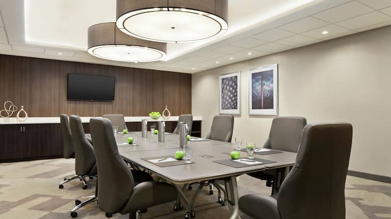 Boardroom with Table, Chairs, and TV