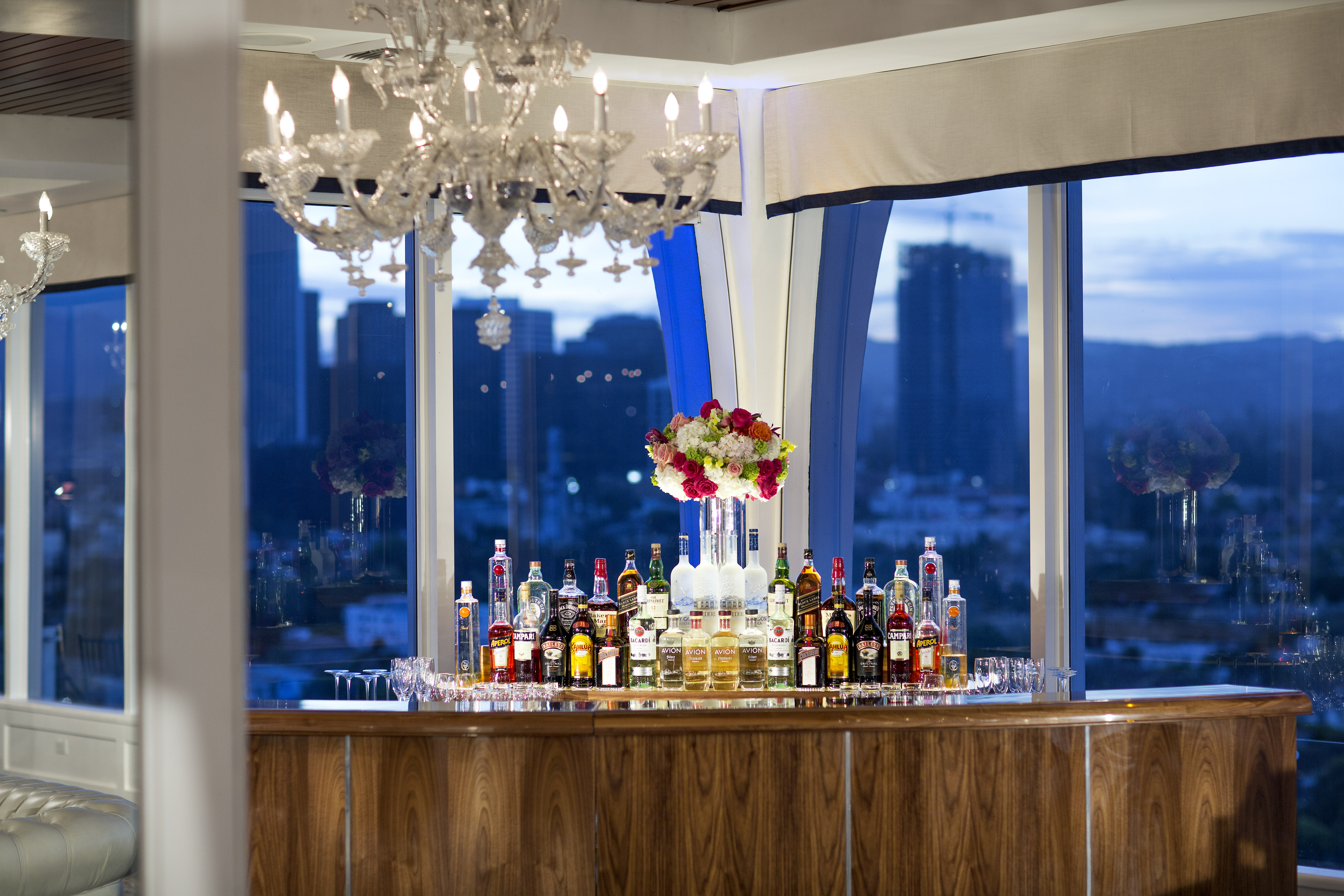 Bar area with drink options and chandelier