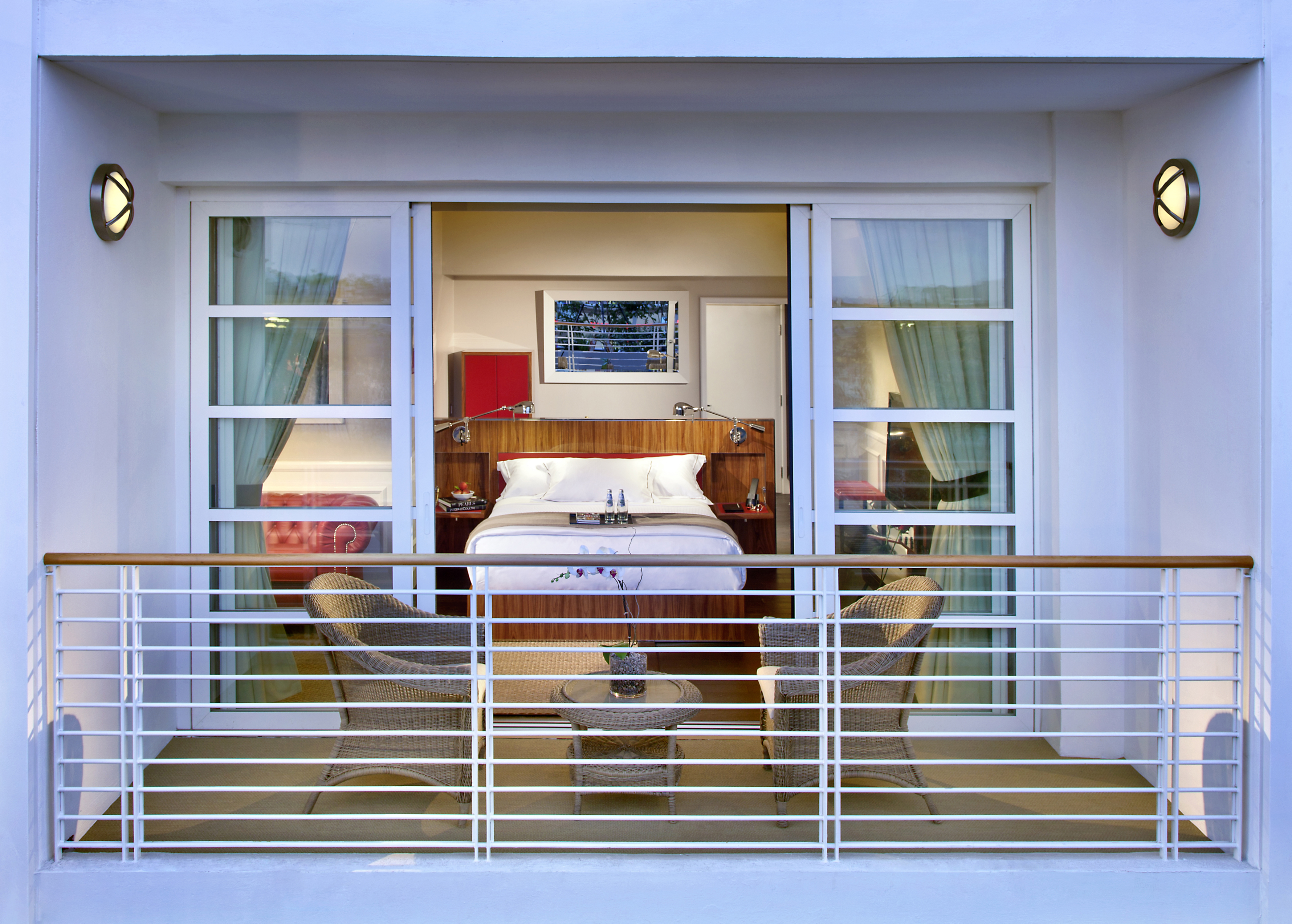 Balcony view with bed and chairs