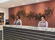 Front Desk with Two Staff Members