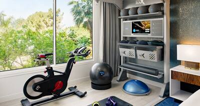 Room with bed and exercise equipment