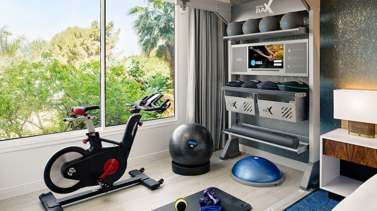 Room with bed and exercise equipment