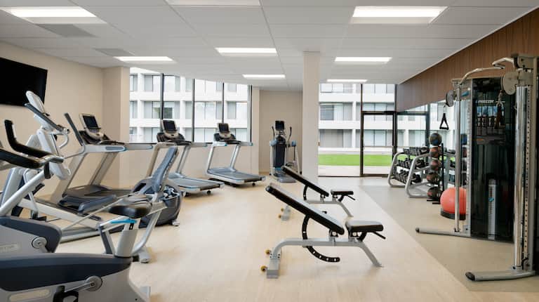 Fitness center with treadmills and weight equipment