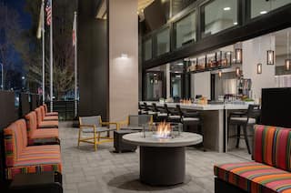 Stunning on-site restaurant featuring spacious outdoor patio with firepit and fully stocked bar.