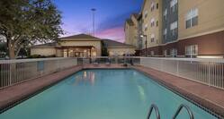 Seasonal Outdoor Pool and Hotel Exterior at Sunset