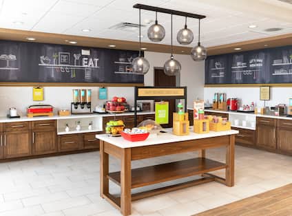 The breakfast area filled with eggs, juices, smoothies, waffles and more at a Hampton by Hilton. 