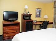 Guestroom with King Bed, Work Desk, Television, Microwave and Mini Fridge