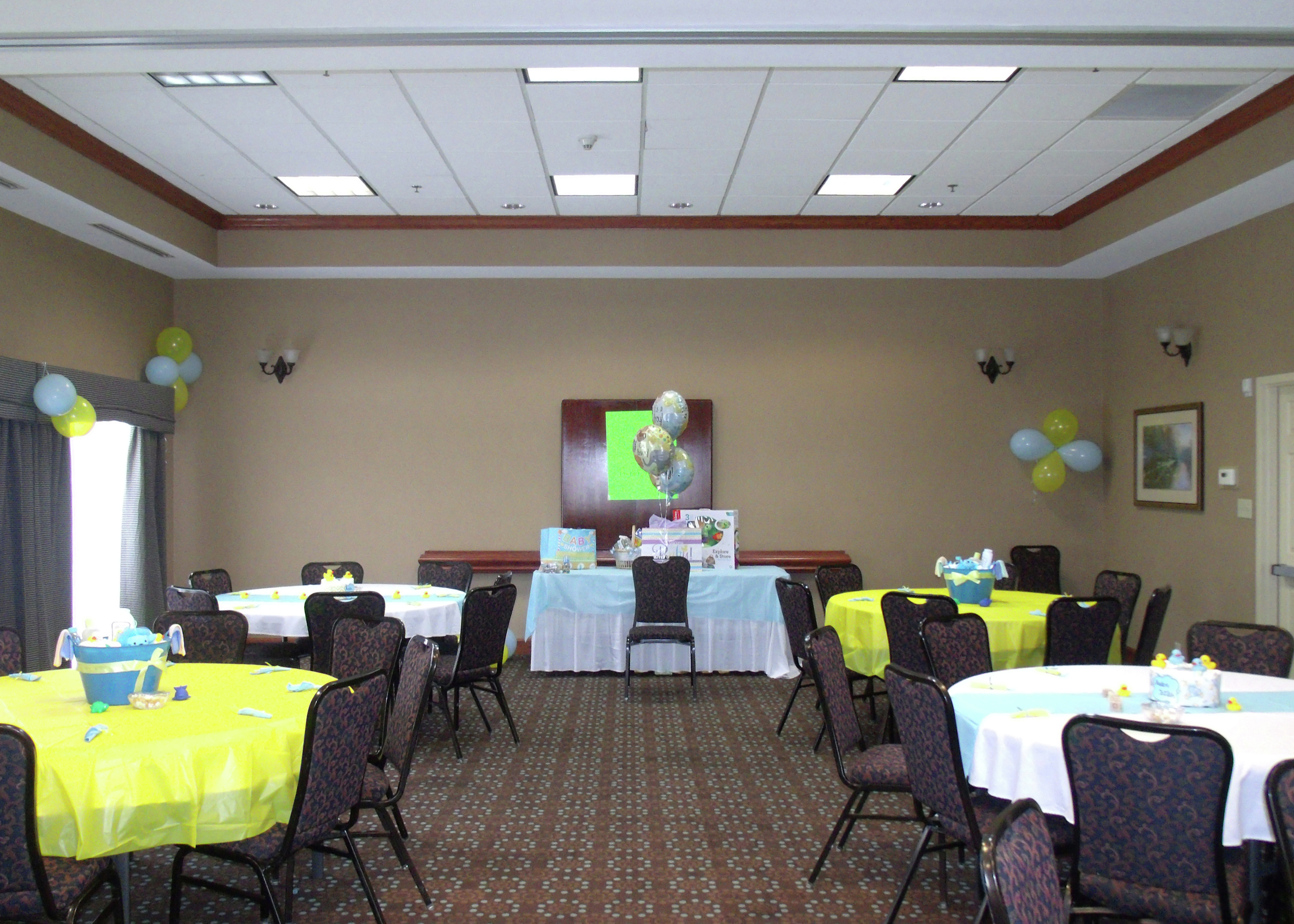 Meeting Room with Round Decorated Banquet Tables
