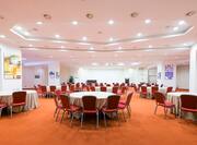 Carlo V  Conference Room  Set up With Round Tables and Podium