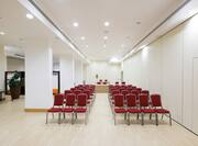 Red Chairs With Theater Setup in Grecìa Conference Room