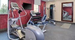 Fitness Center with Cross-Trainer, Cycle Machine, Dumbbell Rack, Weight Machine and Wall Mounted HDTV