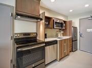 Studio Kitchenette with Full Range, Fridge, Microwave, Sink, Dishwasher and Spacious Walkway