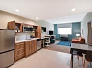 1 Bedroom Suite Kitchen Area, Looking at Living Area with Seating and Amenities, Plus Large Window