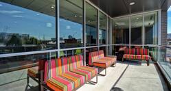 Exterior Patio Soft Seating Area with Bright Fiesta Type Colored Upholstery on Concrete