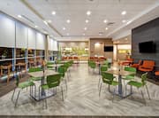 Four Top Tables with Bright Green Modern Chairs in Lobby and Breakfast Area