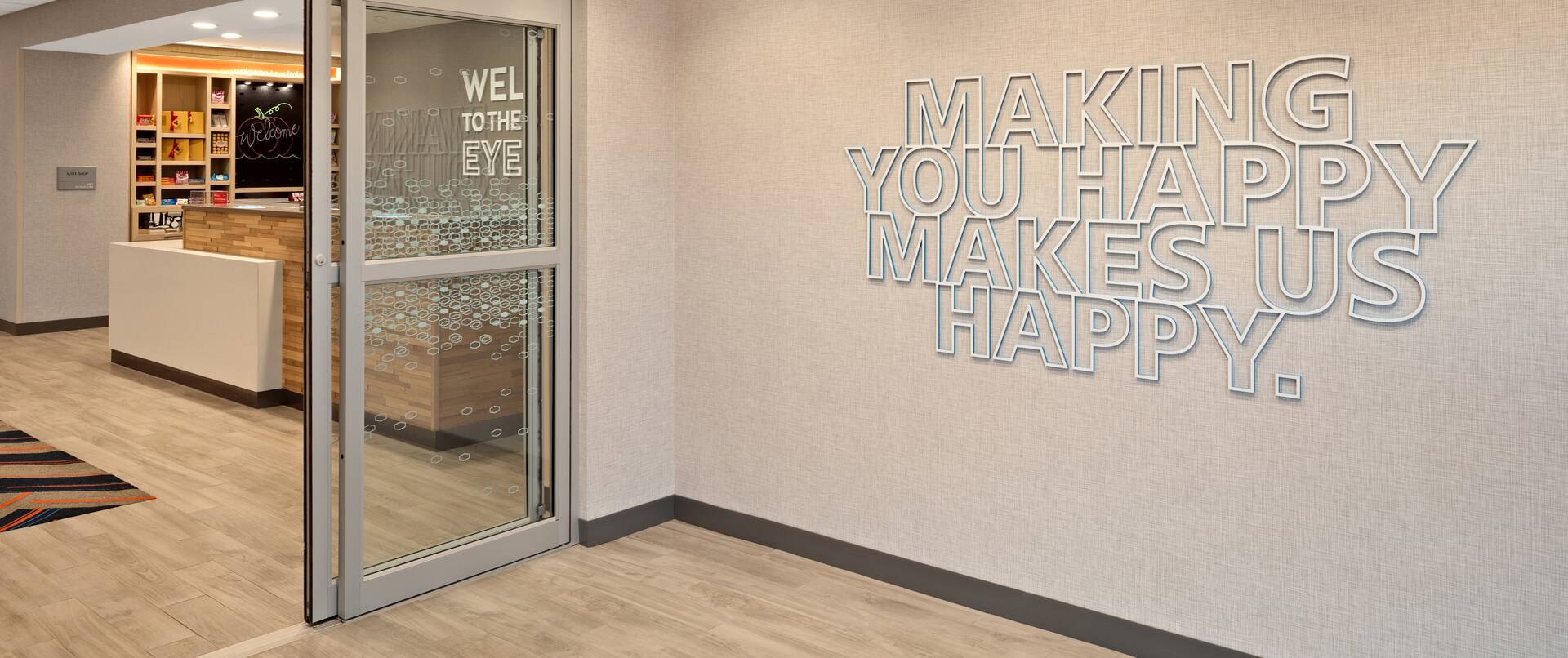lobby entrance, hotel sign - making you happy makes us happy
