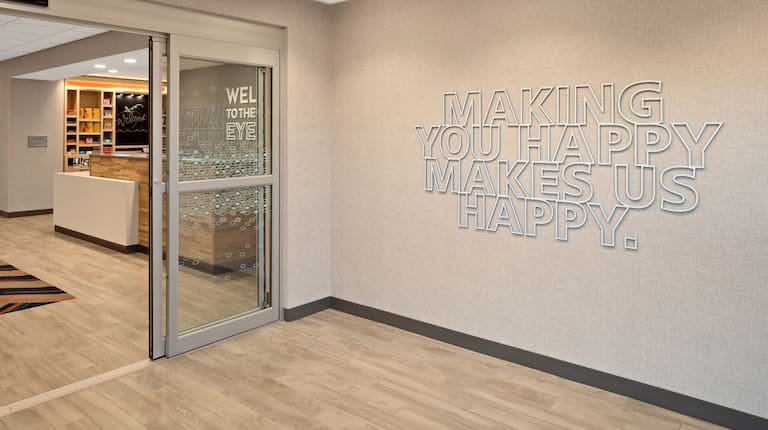 lobby entrance, hotel sign - making you happy makes us happy