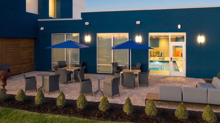 outdoor patio at night, entrance to the pool room