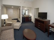 Accessible Guestroom Suite Living Area with Lounge Area, Room Technology, Mirror, and Kitchenette