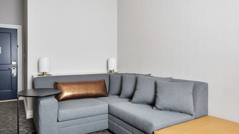L-Shaped Couch in Corner of Suite Living Room